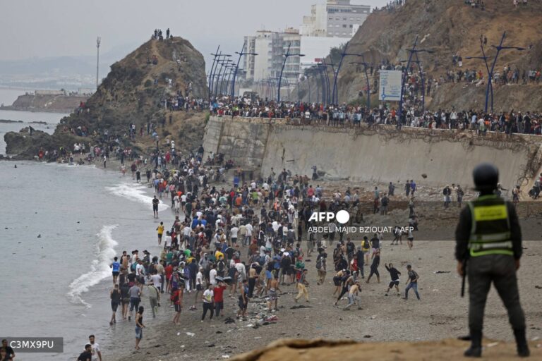 At least 18 dead as thousands cross into Spain from Morocco